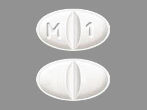 uv; iy. . Oval pill with m on one side